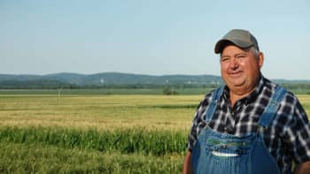 Farmer standing in a field